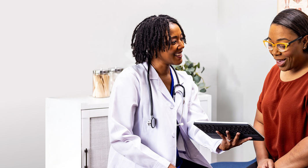 Woman speaking with her doctor and smiling
